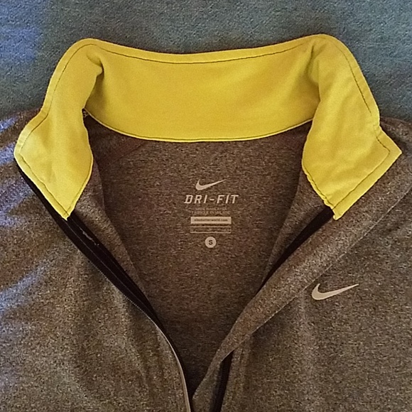 Nike Tops - NWOT Nike Dri-FIT top with reflective strips